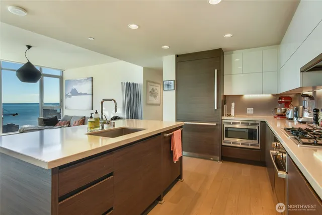 a kitchen with a sink and a stove top oven