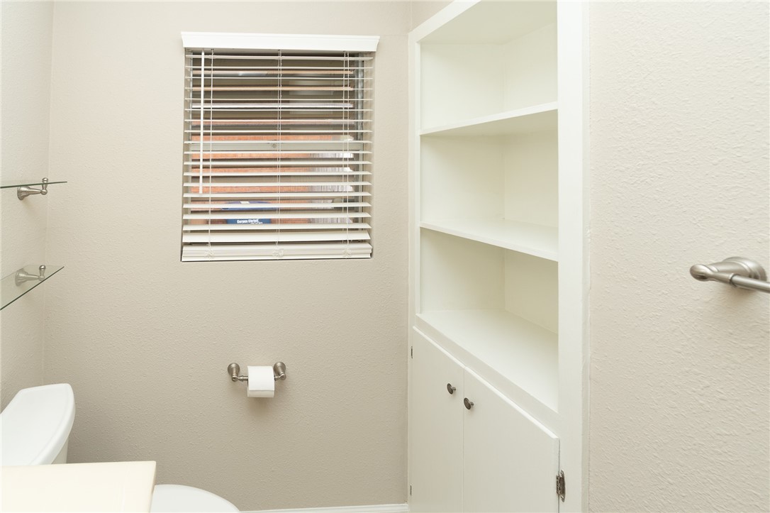 4213 Dolphin Place Corpus Christi, TX 78411 - Photo 13 of 27 a bathroom with a toilet and a sink