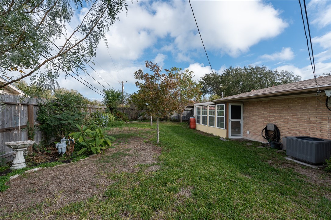 4213 Dolphin Place Corpus Christi, TX 78411 - Photo 24 of 27 a backyard of a house with table and chairs