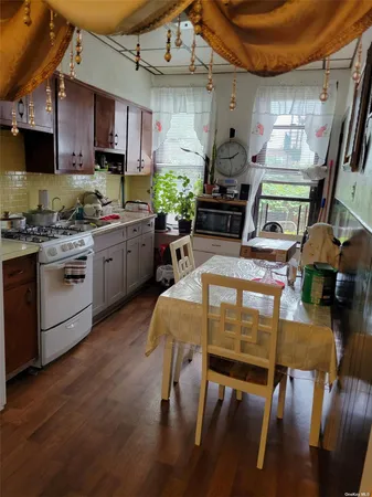 a room with lots of furniture and a chandelier
