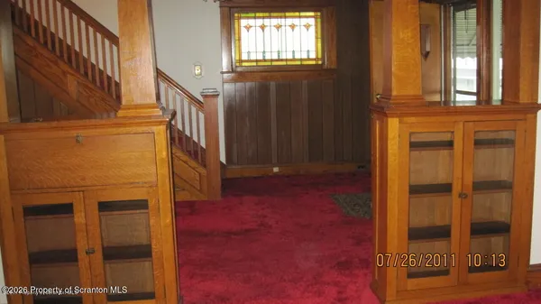 a view of an empty room and a window