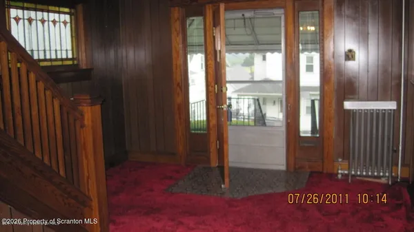 a view of a hallway with windows