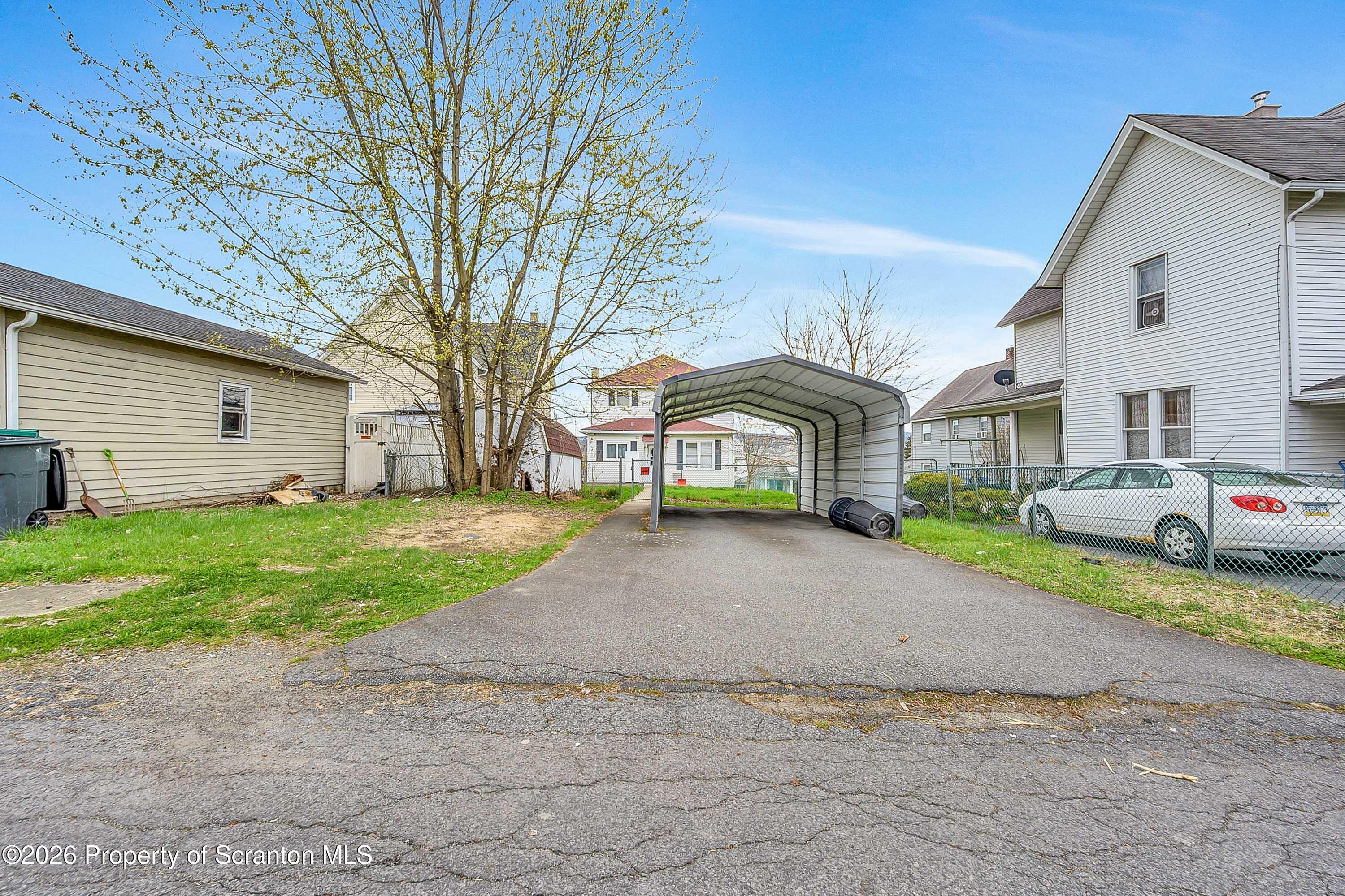 1425 Church Avenue Scranton, PA 18508 - Photo 2 of 21 a front view of a house with a yard and garage