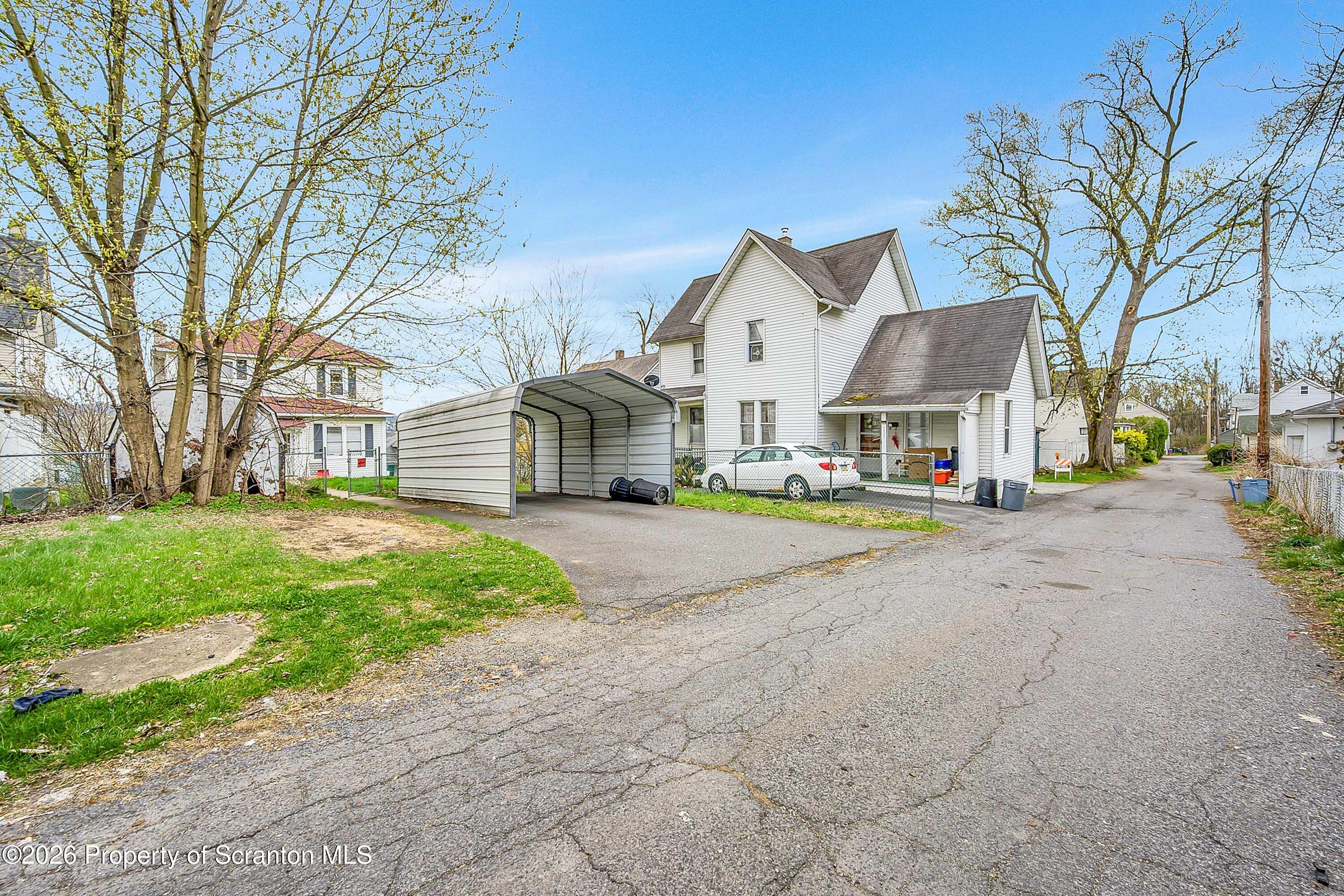 1425 Church Avenue Scranton, PA 18508 - Photo 3 of 21 a view of a house with a yard and large tree