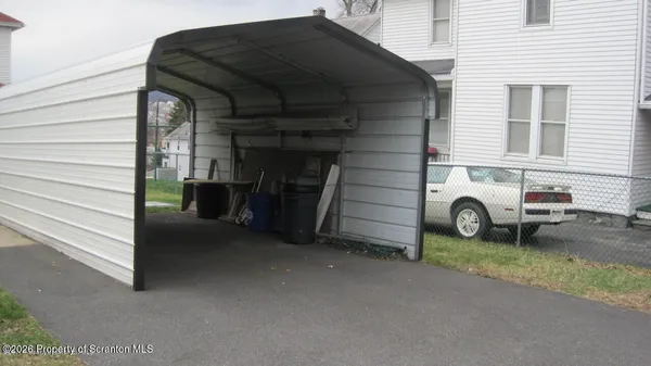 a view of a car in front of a house