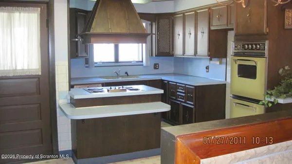 a kitchen with a cabinets and a stove