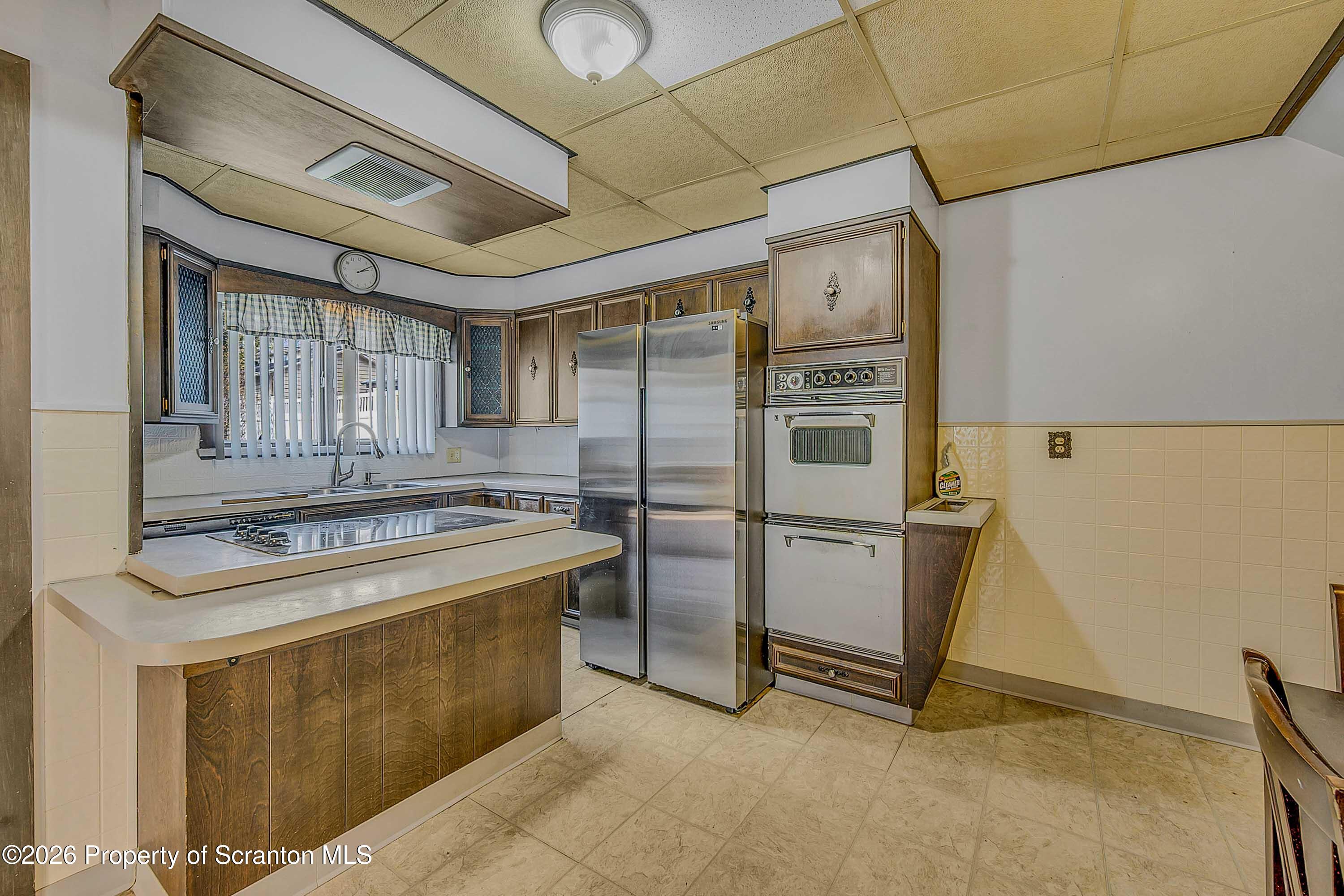1425 Church Avenue Scranton, PA 18508 - Photo 10 of 21 a kitchen with stainless steel appliances granite countertop a stove a refrigerator and a sink