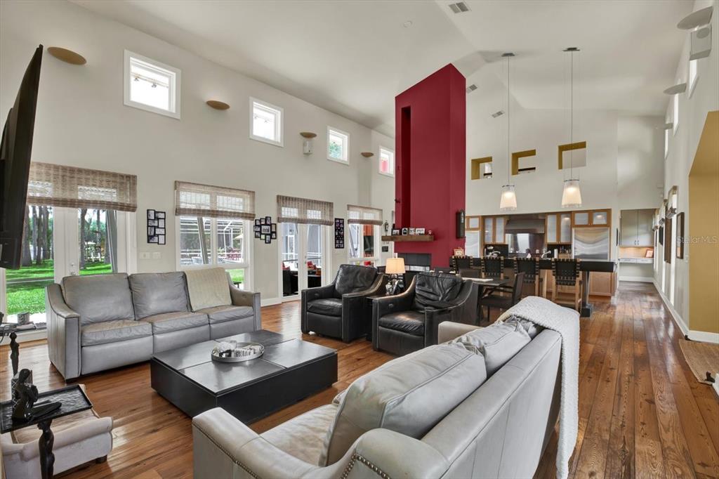 4541 School Road Land O' Lakes, FL 34638 - Photo 12 of 68 a living room with furniture kitchen view and a large window