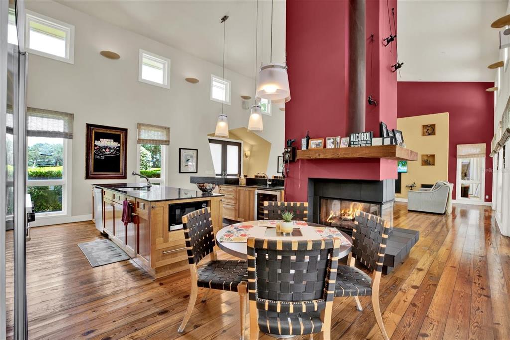 4541 School Road Land O' Lakes, FL 34638 - Photo 15 of 68 a living room with furniture a fireplace and a table