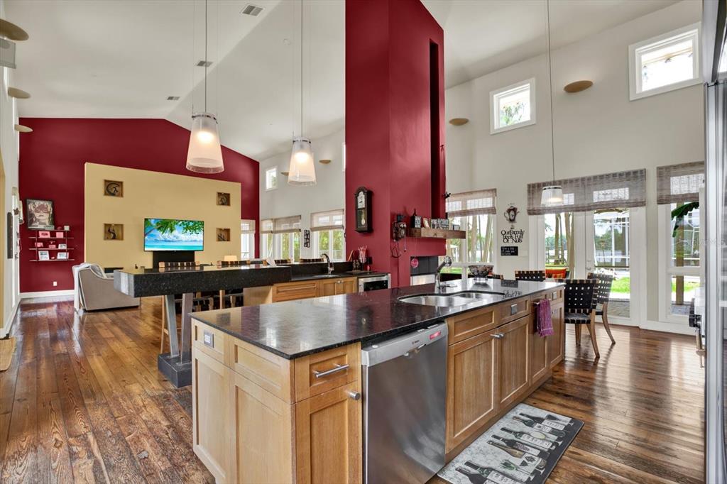 4541 School Road Land O' Lakes, FL 34638 - Photo 17 of 68 a kitchen with stainless steel appliances granite countertop a stove and a wooden floors