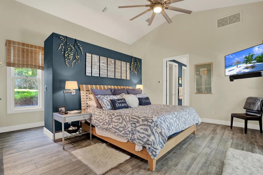 4541 School Road Land O' Lakes, FL 34638 - Photo 19 of 68 a bedroom with a bed and a table in it