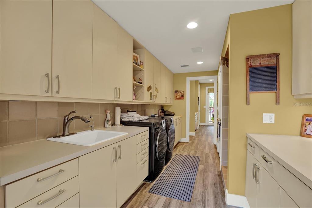 4541 School Road Land O' Lakes, FL 34638 - Photo 29 of 68 a kitchen with a sink stove and cabinets