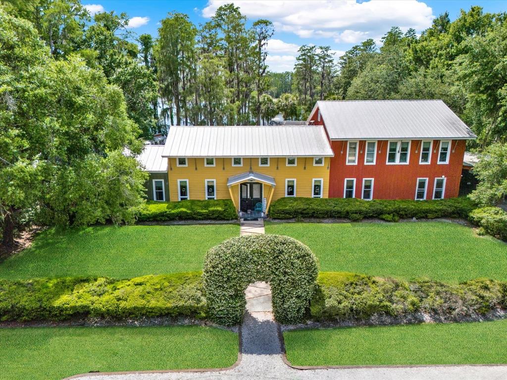 4541 School Road Land O' Lakes, FL 34638 - Photo 3 of 68 a front view of a house with garden