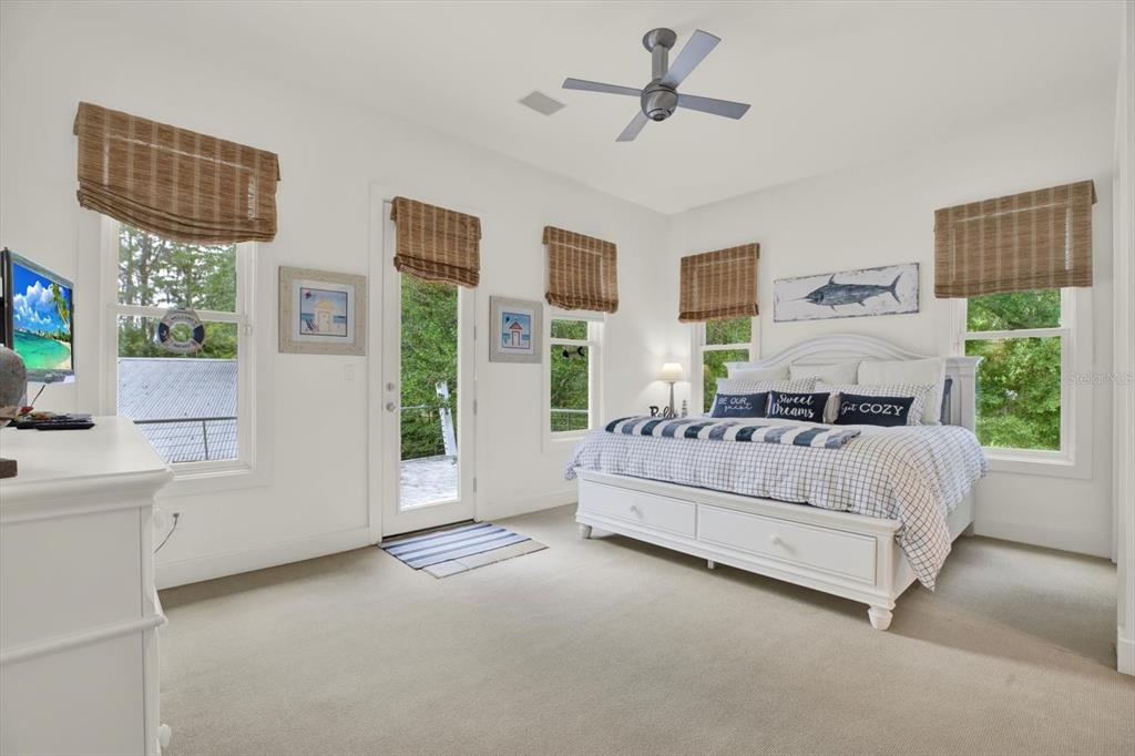 4541 School Road Land O' Lakes, FL 34638 - Photo 36 of 68 a bed room with a bed and a couch