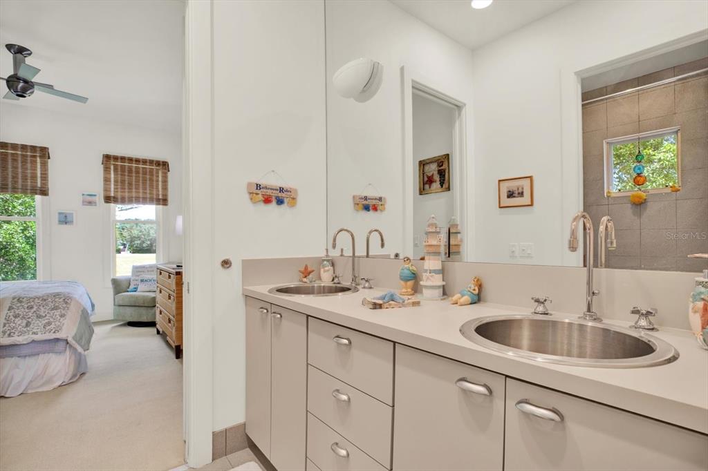 4541 School Road Land O' Lakes, FL 34638 - Photo 38 of 68 a bathroom with a sink and a mirror