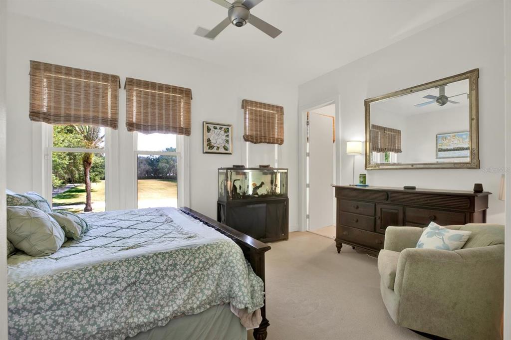 4541 School Road Land O' Lakes, FL 34638 - Photo 42 of 68 a bed room with a bed and a couch