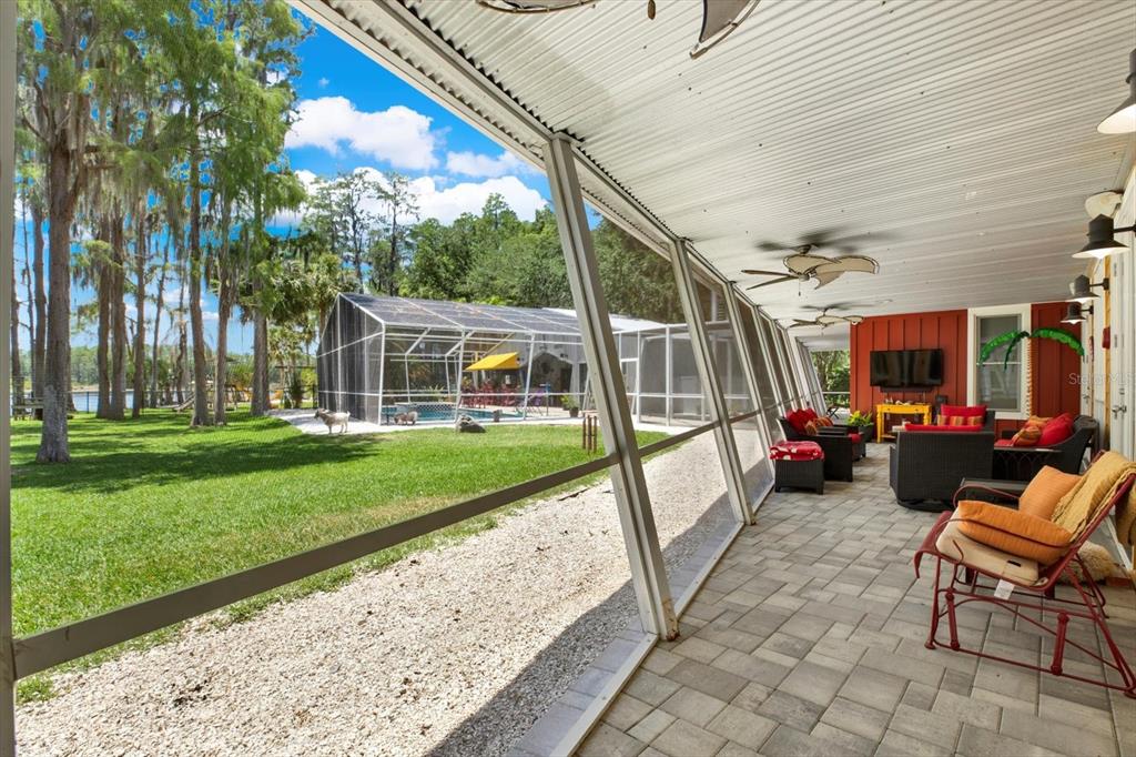 4541 School Road Land O' Lakes, FL 34638 - Photo 49 of 68 a view of a porch with furniture and a yard