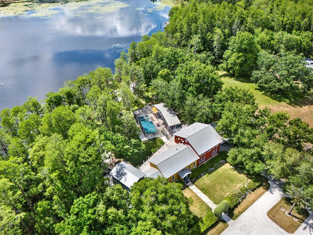 4541 School Road Land O' Lakes, FL 34638 - Photo 62 of 68 an aerial view of a house with garden space and street view
