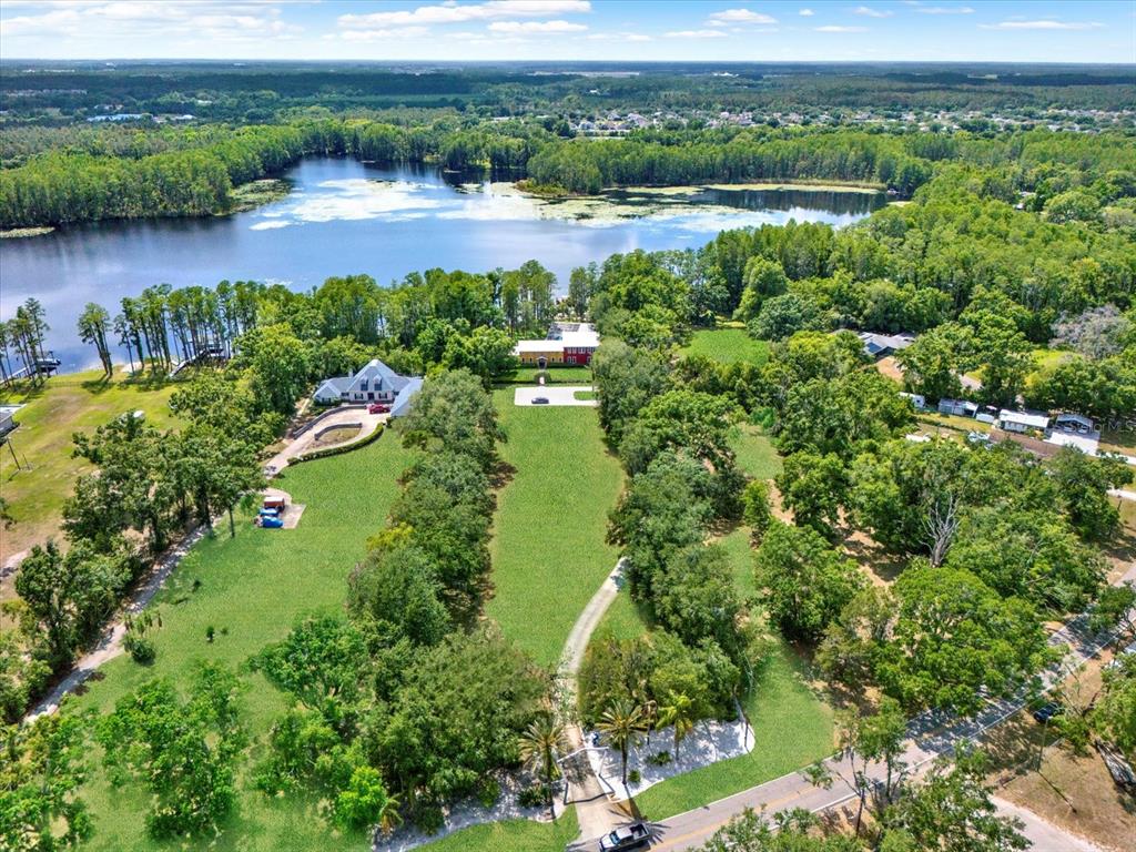 4541 School Road Land O' Lakes, FL 34638 - Photo 67 of 68 an aerial view of a houses with outdoor space and lake view