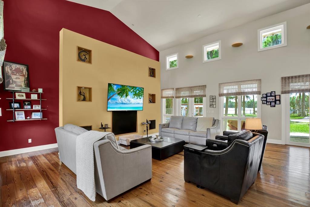 4541 School Road Land O' Lakes, FL 34638 - Photo 10 of 68 a living room with furniture and a flat screen tv