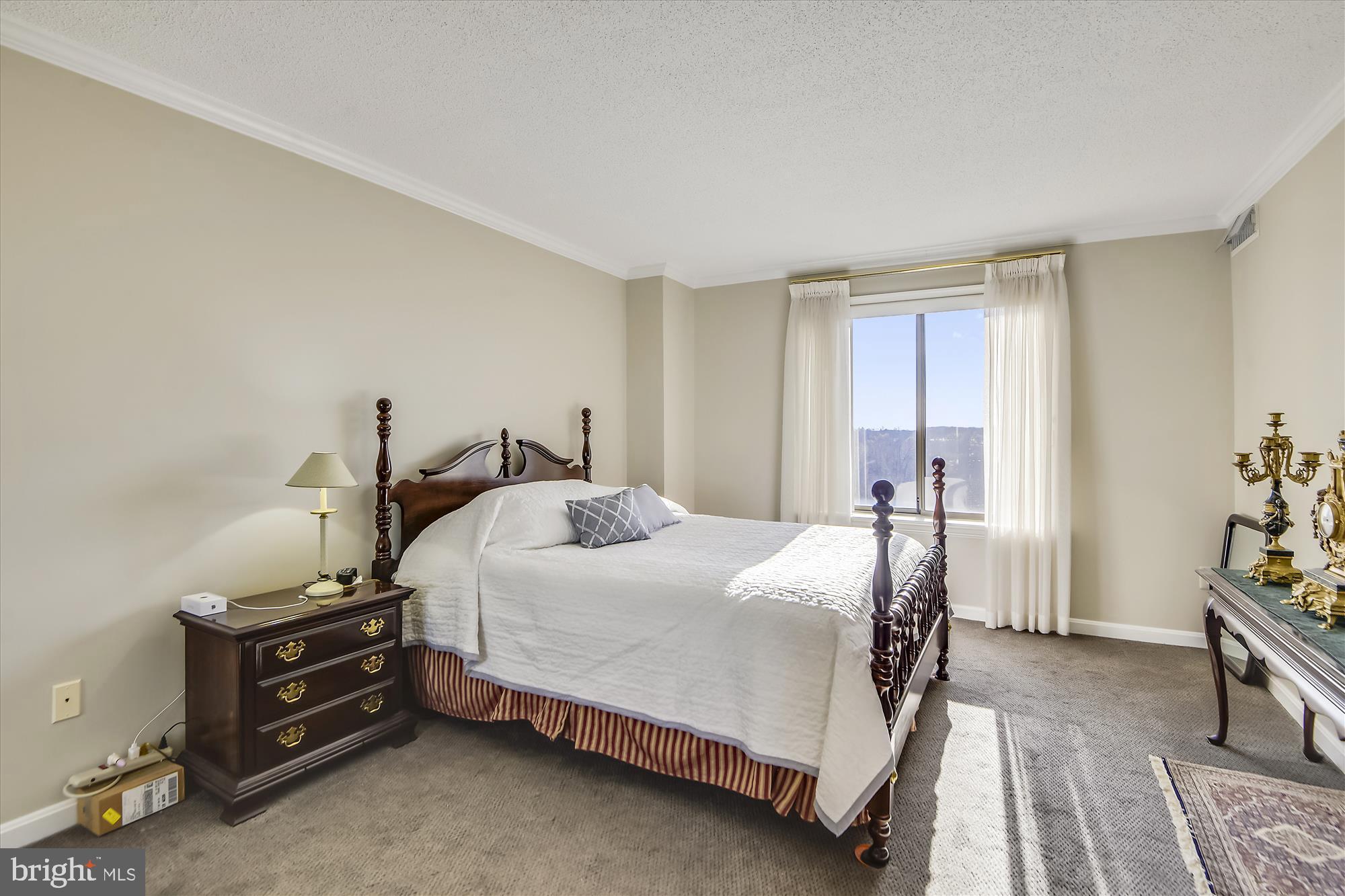 19385 Cypress Ridge Terrace, Unit 920 Leesburg, VA 20176 - Photo 13 of 42 a bedroom with a bed and a tv