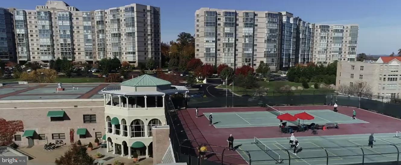 19385 Cypress Ridge Terrace, Unit 920 Leesburg, VA 20176 - Photo 28 of 42 a view of swimming pool with outdoor seating