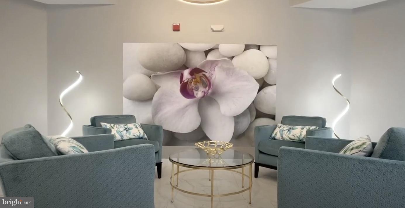 19385 Cypress Ridge Terrace, Unit 920 Leesburg, VA 20176 - Photo 29 of 42 a room with a table and chairs