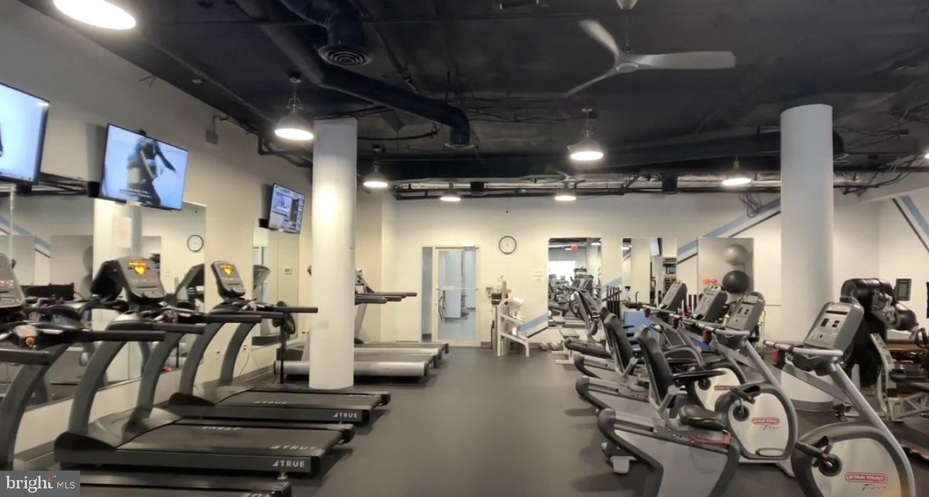 19385 Cypress Ridge Terrace, Unit 920 Leesburg, VA 20176 - Photo 34 of 42 a view of a room with gym equipment