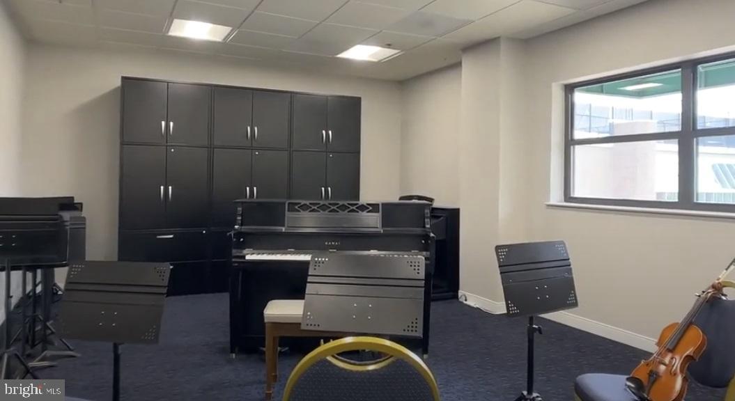 19385 Cypress Ridge Terrace, Unit 920 Leesburg, VA 20176 - Photo 38 of 42 a workspace with furniture and window