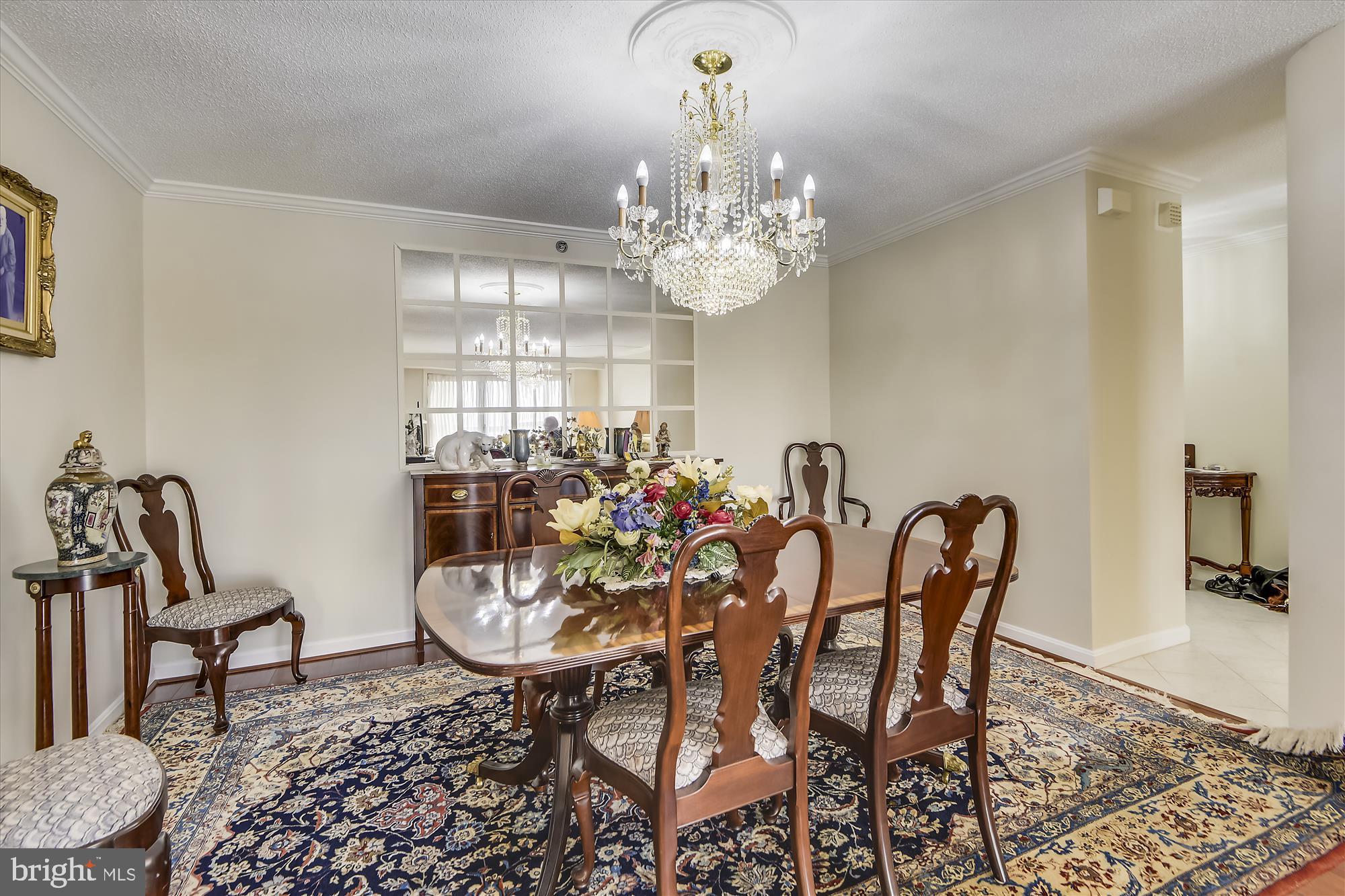 19385 Cypress Ridge Terrace, Unit 920 Leesburg, VA 20176 - Photo 5 of 42 a view of a dining room with furniture and chandelier