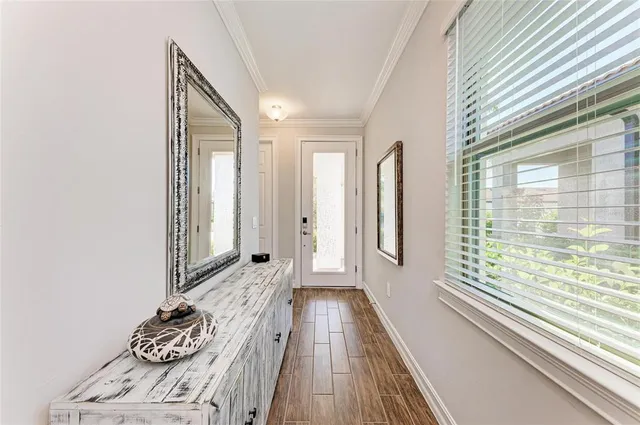 a kitchen with kitchen island a sink appliances and a counter top space