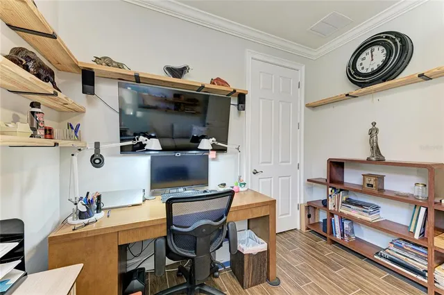an aerial view of a house with a lake view
