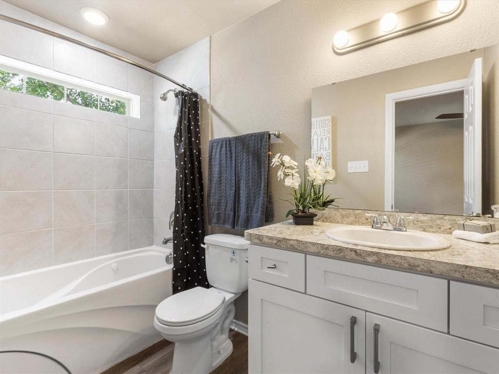 6108 Abrams Road, Unit 505 Dallas, TX 75231 - Photo 18 of 20 a bathroom with a sink toilet and shower