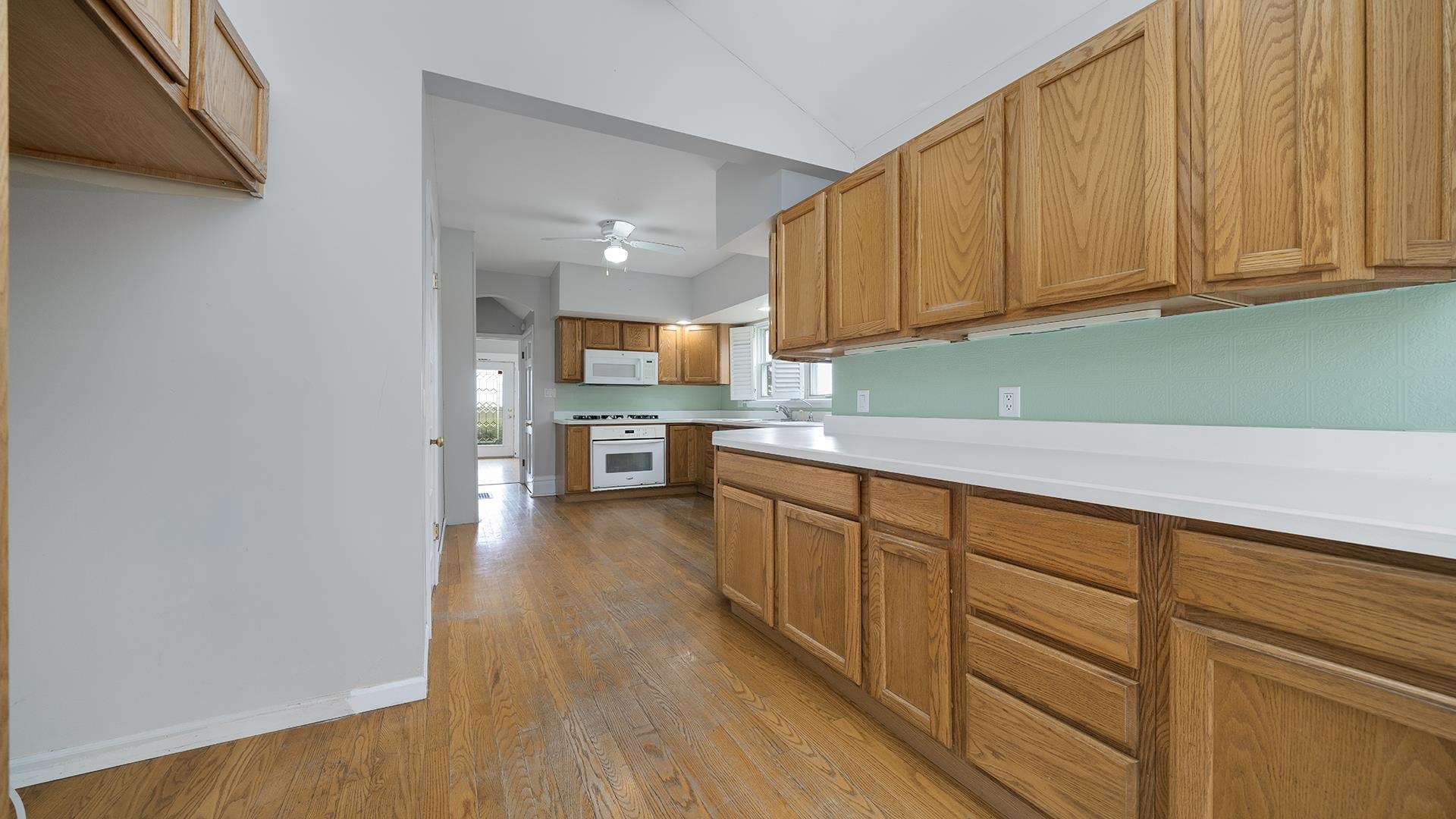 9020 East Flagg Road Rochelle, IL 61068 - Photo 13 of 61 a kitchen with granite countertop wooden cabinets a sink and dishwasher