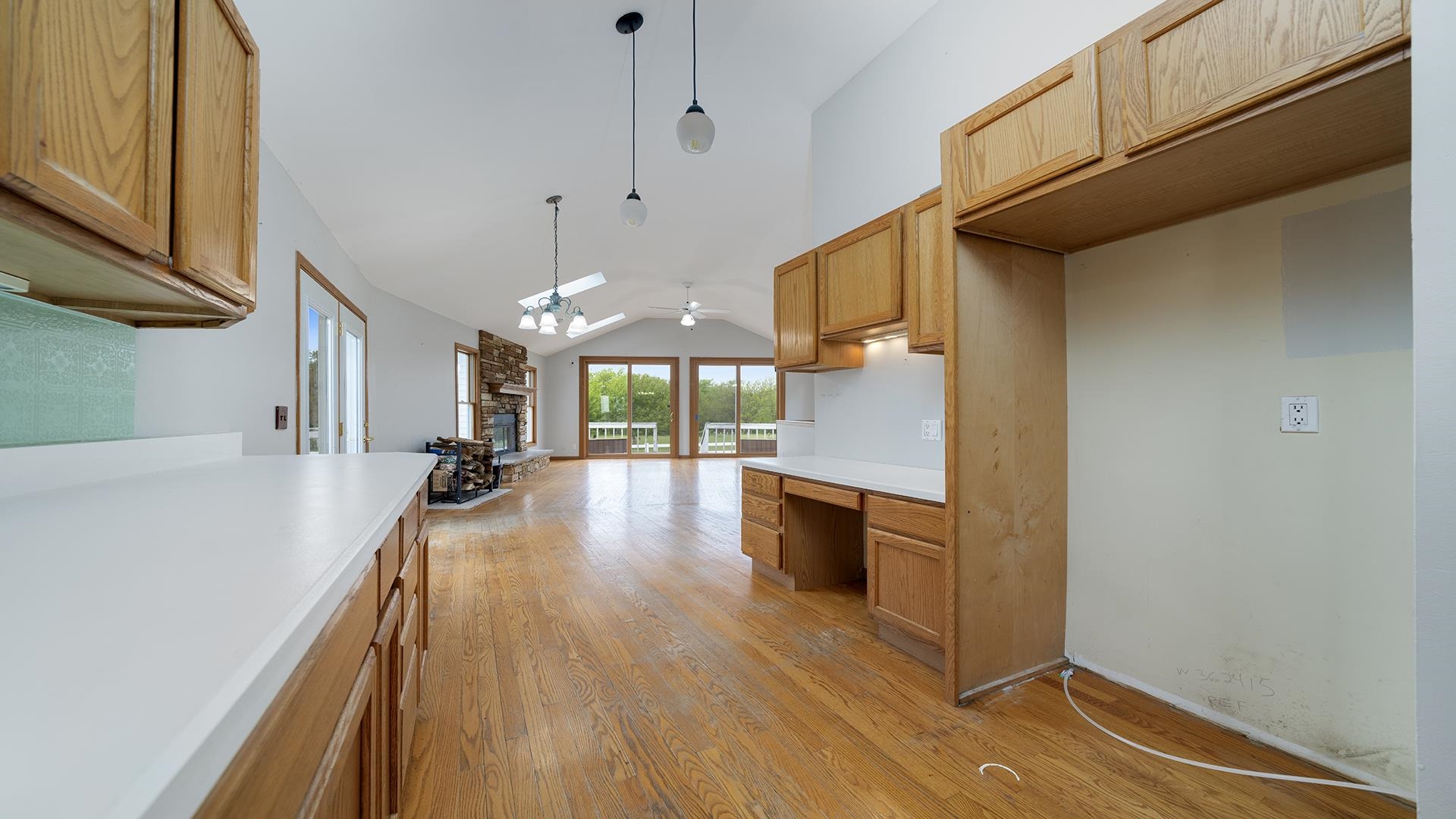 9020 East Flagg Road Rochelle, IL 61068 - Photo 14 of 61 a kitchen with stainless steel appliances granite countertop a refrigerator a sink dishwasher a stove and white countertops with wooden floor