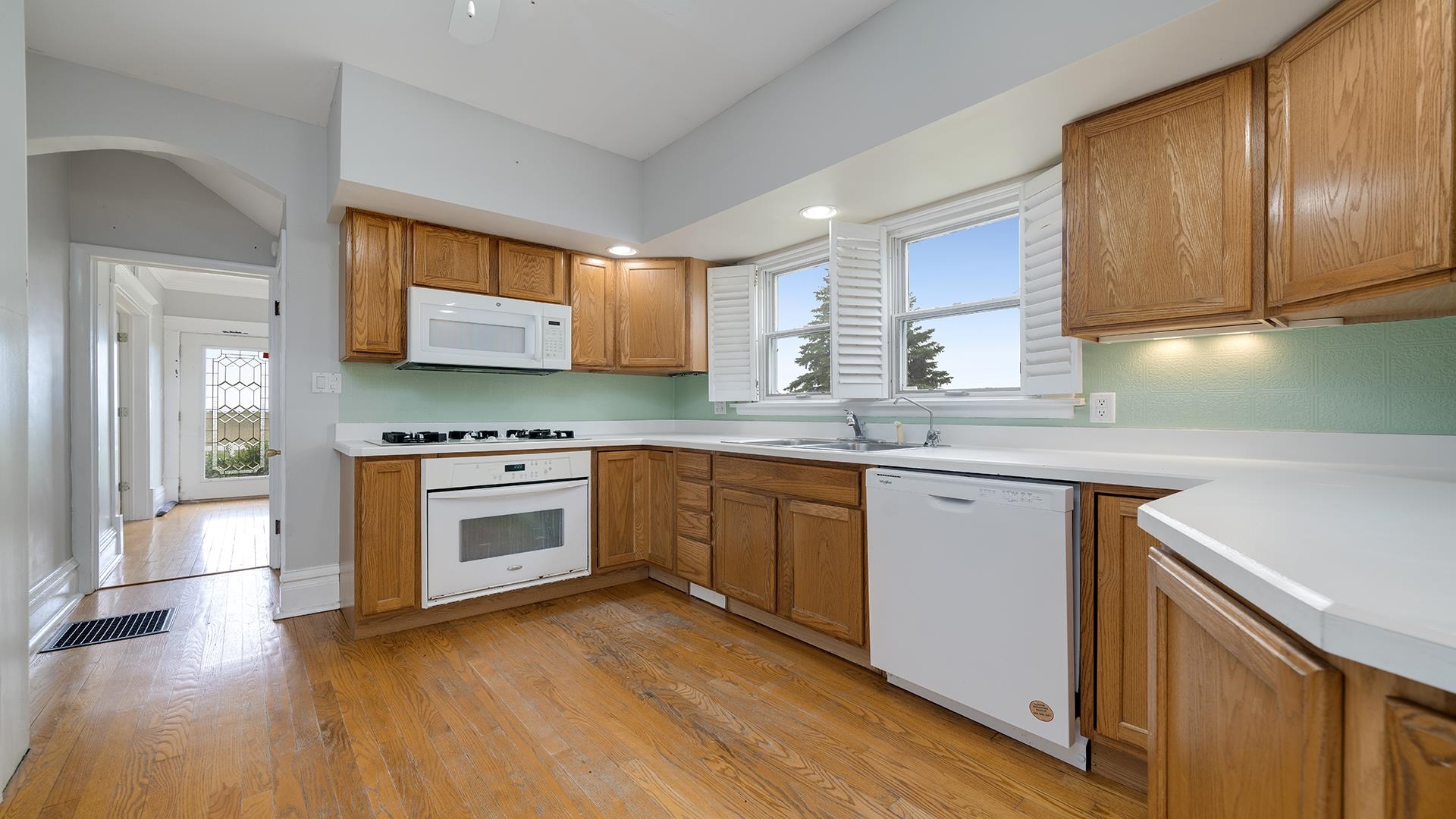 9020 East Flagg Road Rochelle, IL 61068 - Photo 17 of 61 a kitchen with stainless steel appliances granite countertop a stove a sink and a microwave