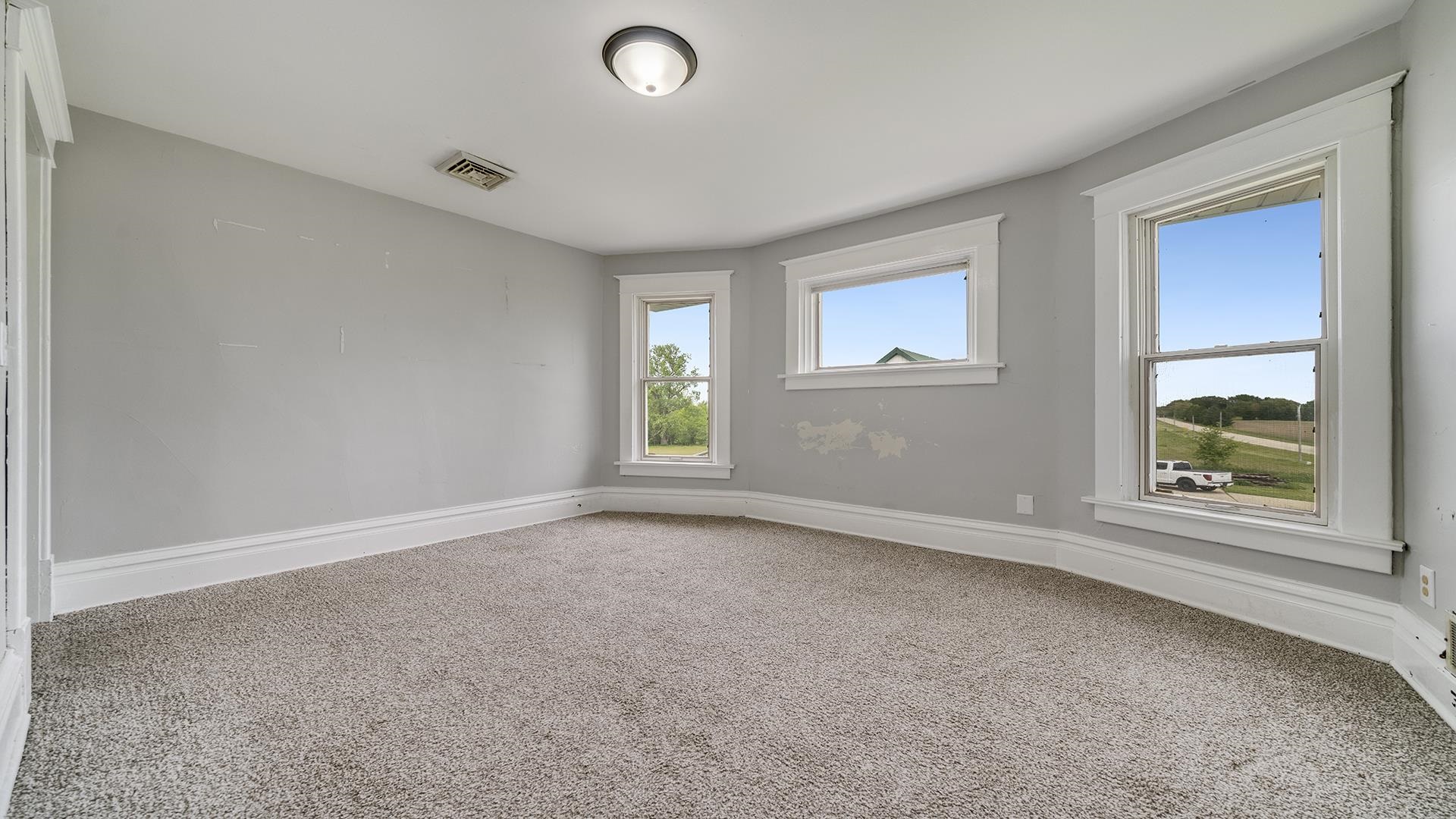 9020 East Flagg Road Rochelle, IL 61068 - Photo 31 of 61 an empty room with windows