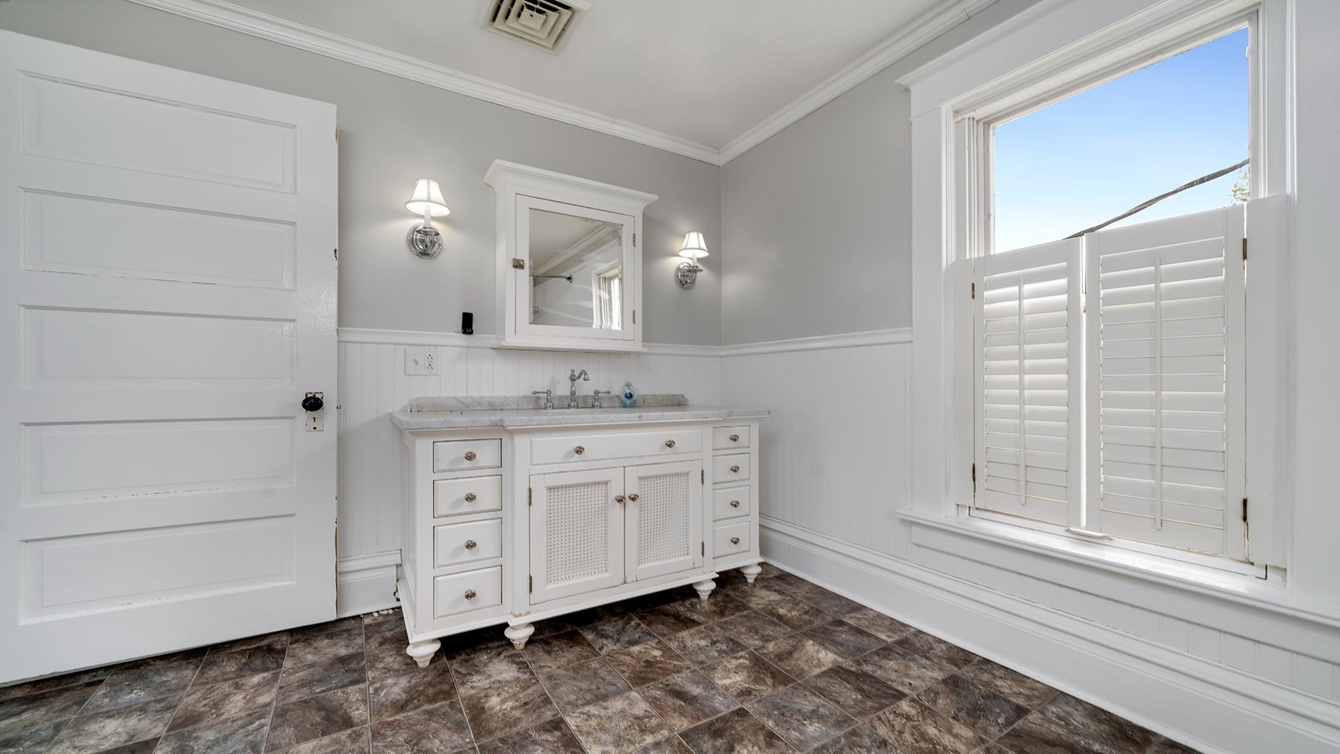 9020 East Flagg Road Rochelle, IL 61068 - Photo 34 of 61 a bathroom with a sink a mirror and a shower