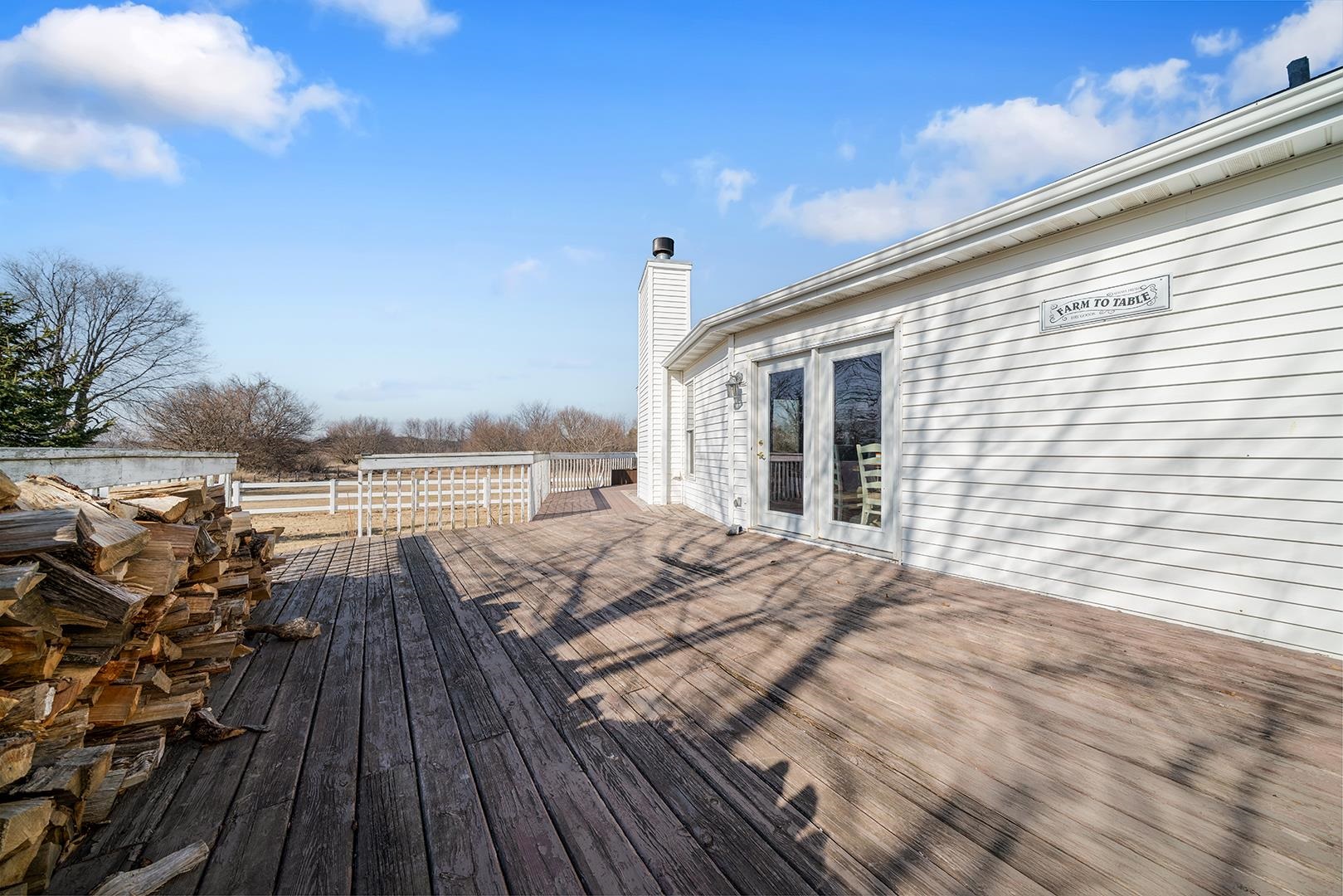 9020 East Flagg Road Rochelle, IL 61068 - Photo 38 of 61 a view of a balcony with wooden floor
