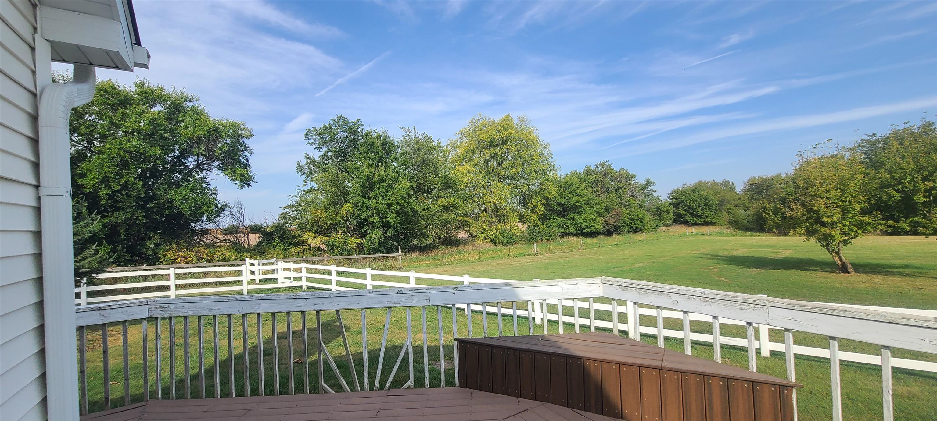 9020 East Flagg Road Rochelle, IL 61068 - Photo 57 of 61 a view of a balcony with lake view and a trees