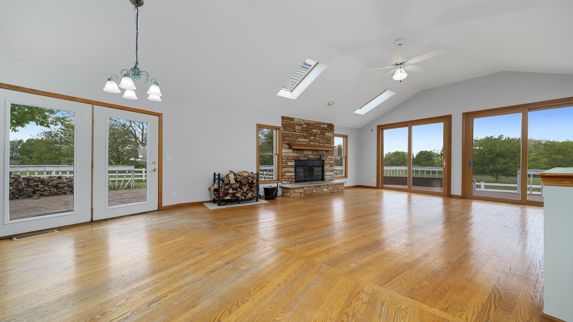 9020 East Flagg Road Rochelle, IL 61068 - Photo 7 of 61 a view of a livingroom with furniture water view and large windows