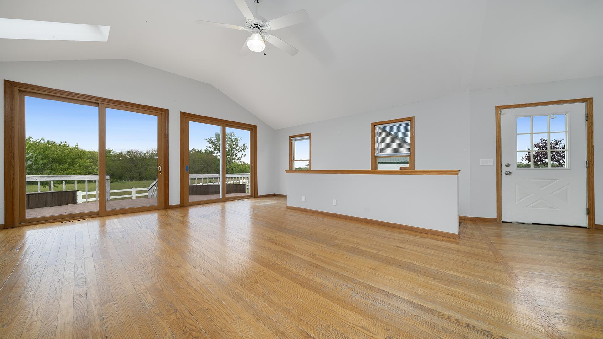 9020 East Flagg Road Rochelle, IL 61068 - Photo 9 of 61 a view of empty room with wooden floor and fan