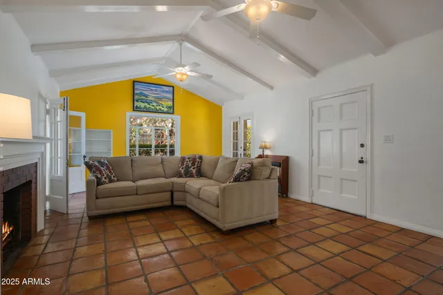 a living room with furniture and a fireplace