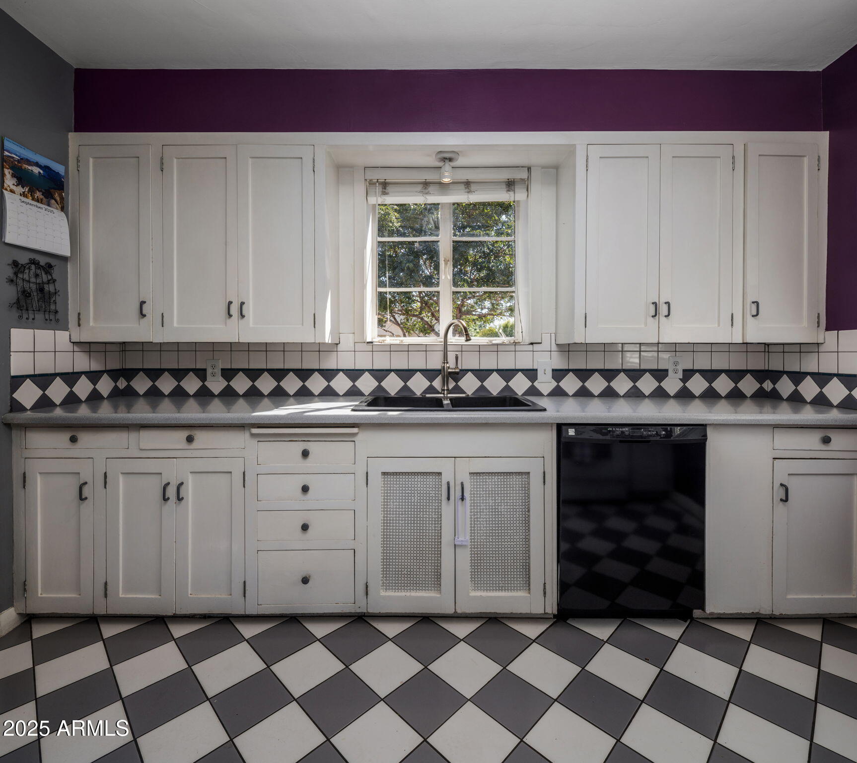 136 West Granada Road Phoenix, AZ 85003 - Photo 11 of 57 a view of a kitchen with granite countertop white cabinets and black appliances