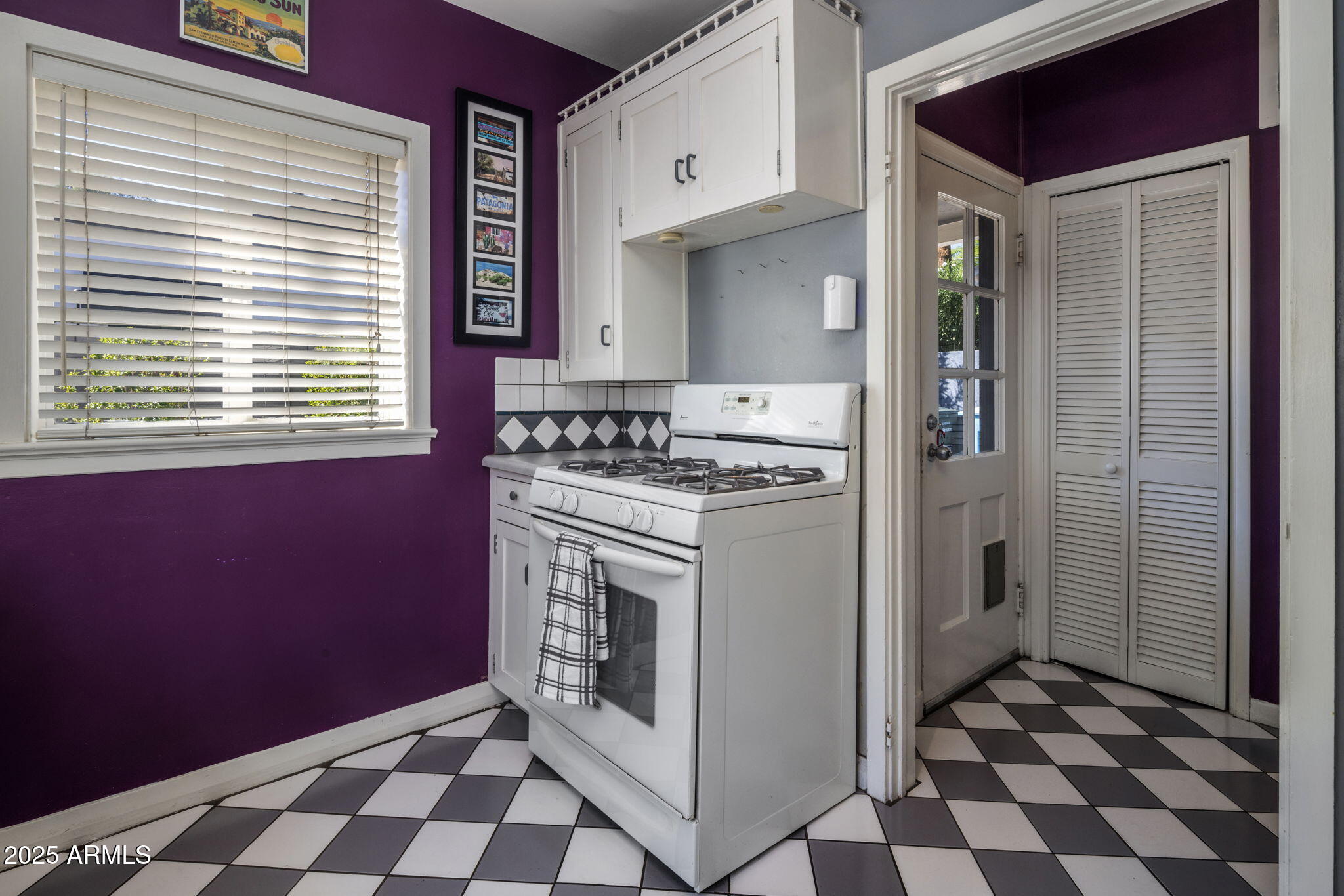 136 West Granada Road Phoenix, AZ 85003 - Photo 13 of 57 a kitchen with a stove a refrigerator and a sink