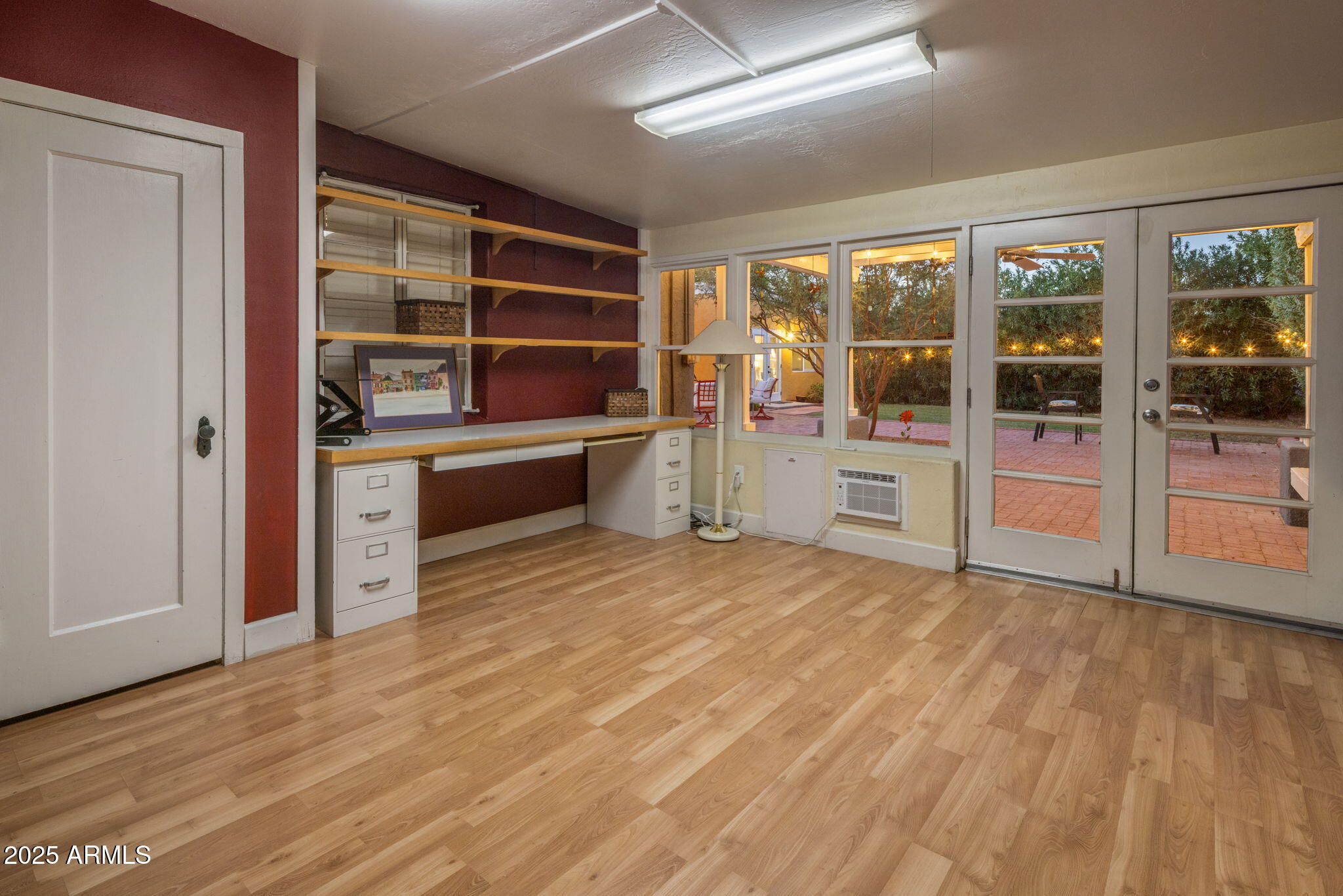 136 West Granada Road Phoenix, AZ 85003 - Photo 21 of 57 a view of an empty room with wooden floor and windows