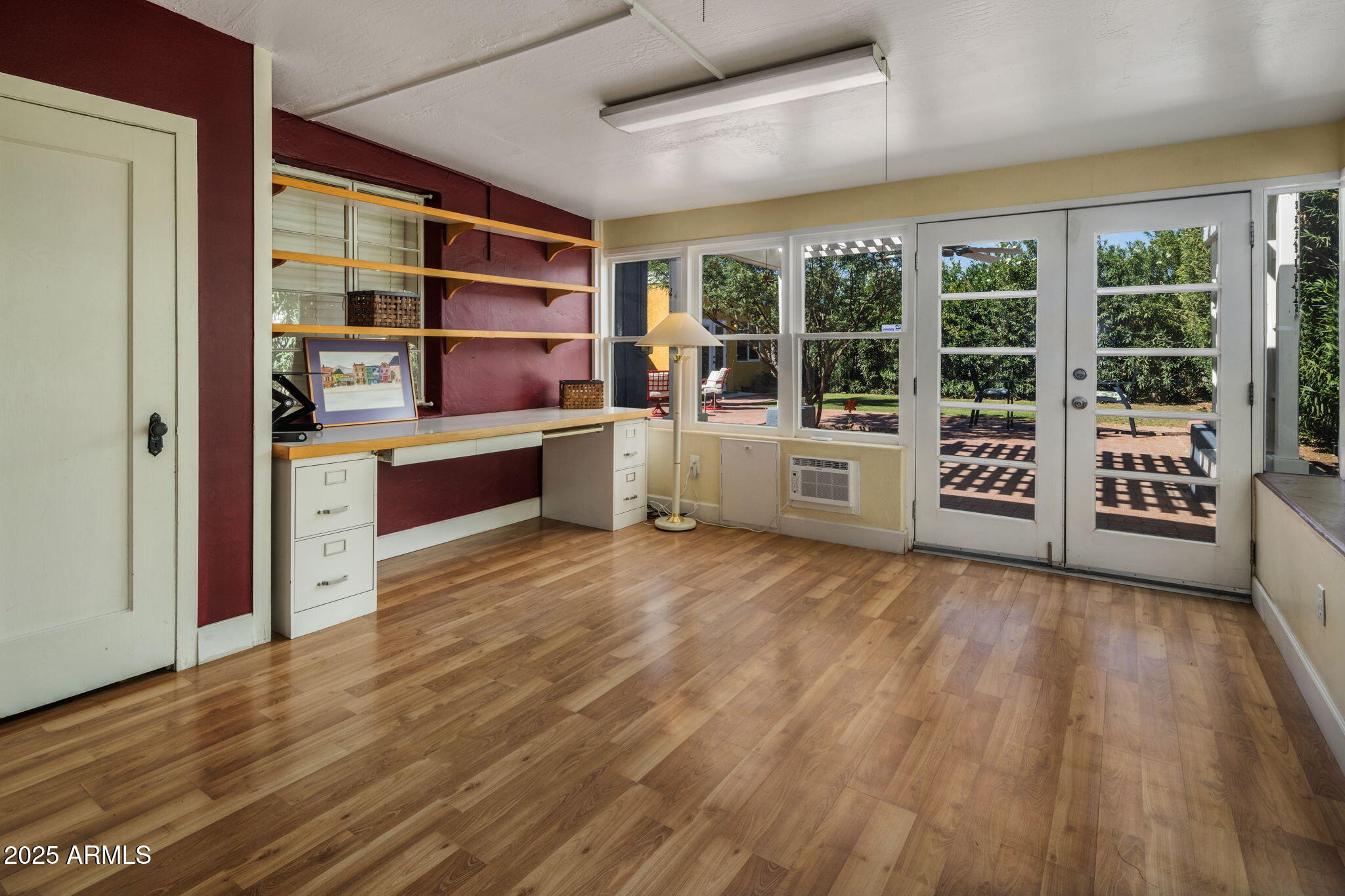 136 West Granada Road Phoenix, AZ 85003 - Photo 22 of 57 a room with wooden floors and windows