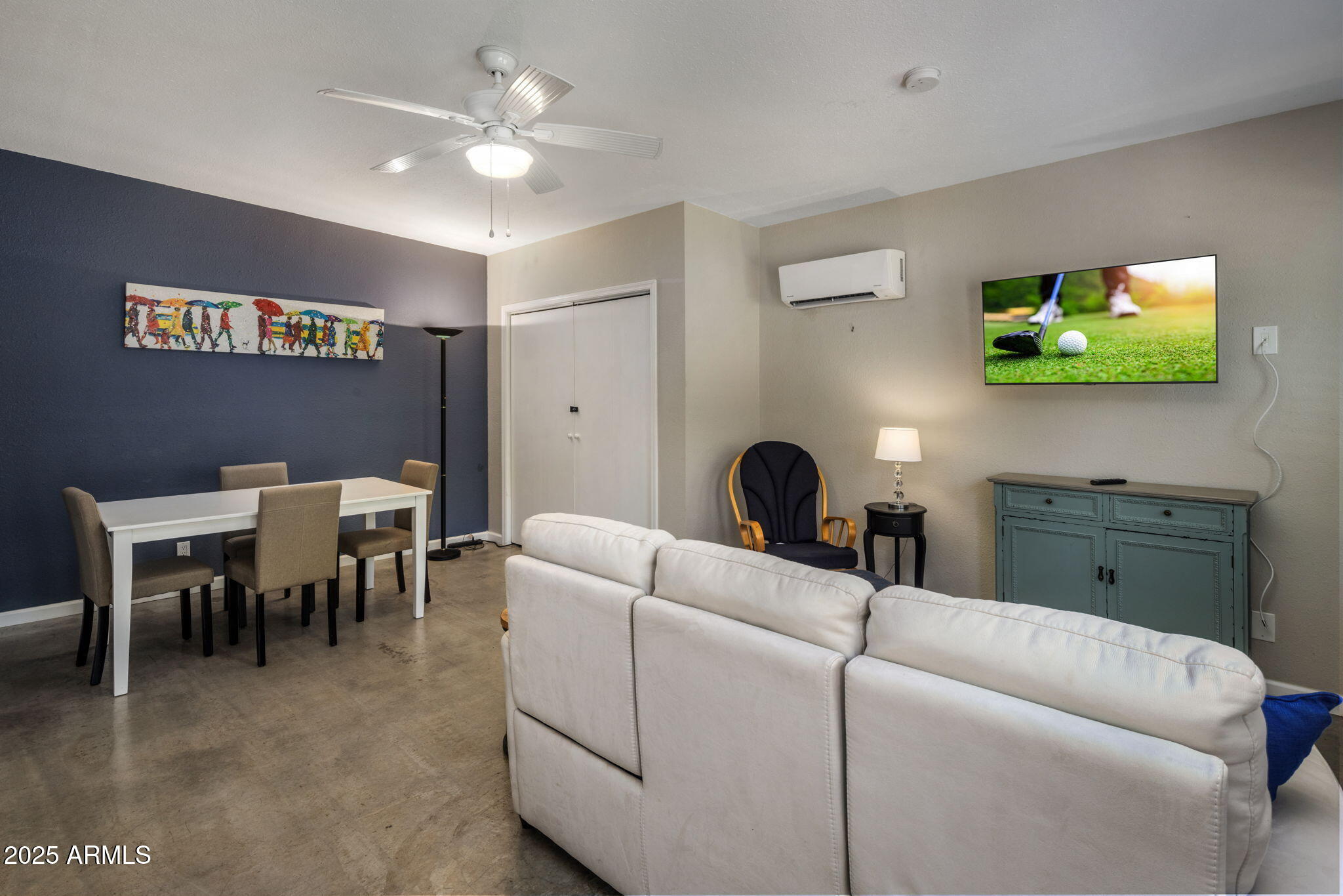 136 West Granada Road Phoenix, AZ 85003 - Photo 33 of 57 a living room with furniture and a flat screen tv