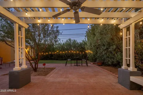 a view of a chairs and table in the patio