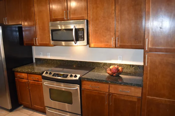 a kitchen with a stove and a microwave